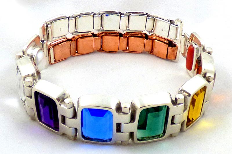 crystal healing jewelry with deeply colored quartz crystals and pure metals